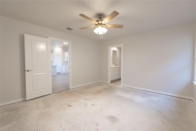 unfurnished room featuring baseboards, concrete floors, visible vents, and a ceiling fan