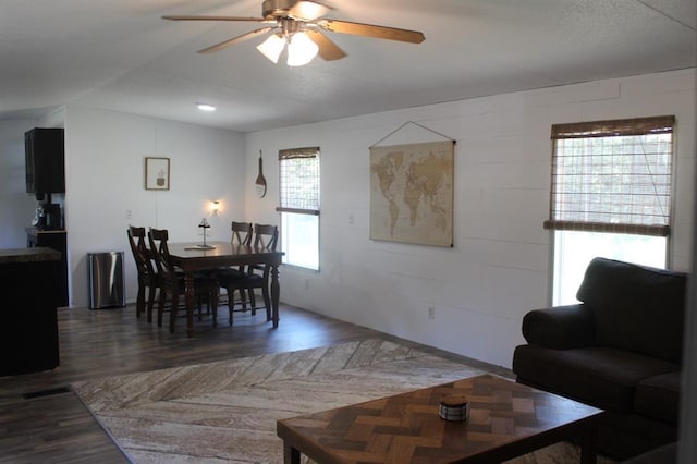 dining area featuring ceiling fan and dark hardwood / wood-style flooring