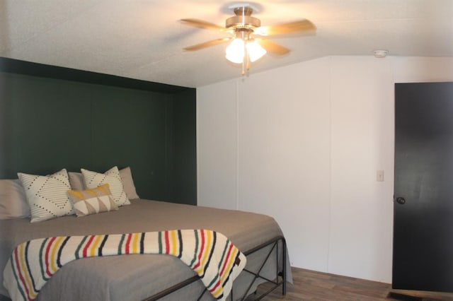 bedroom with ceiling fan and hardwood / wood-style flooring