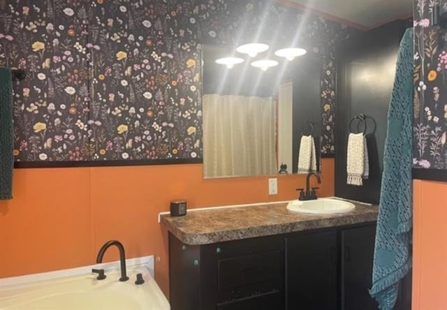 bathroom featuring vanity and a tub to relax in