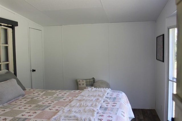 bedroom with hardwood / wood-style flooring