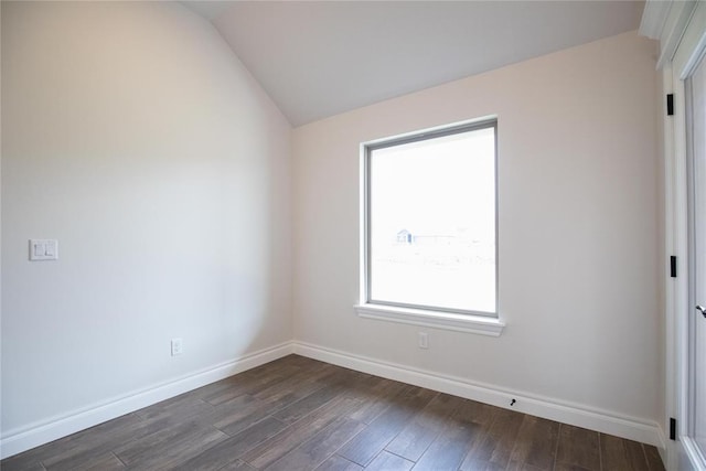 9312 Poppey Pl, Yukon, OK 73099 - spare room featuring lofted ceiling, dark wood finished floors, and baseboards