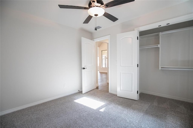 9312 Poppey Pl, Yukon, OK 73099 - unfurnished bedroom with carpet, baseboards, a ceiling fan, and a closet