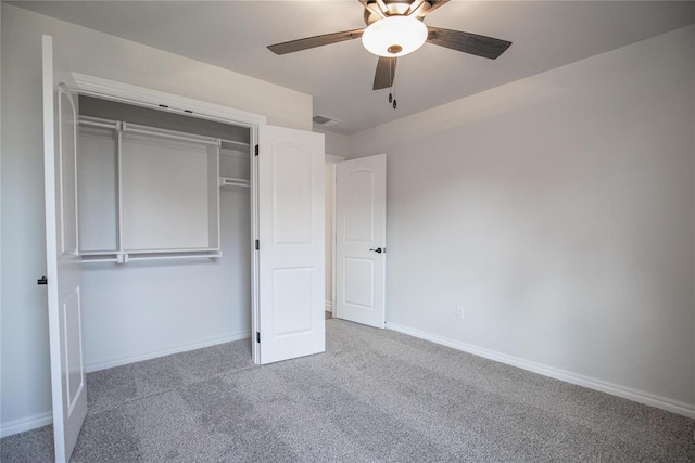 9312 Poppey Pl, Yukon, OK 73099 - unfurnished bedroom with carpet, baseboards, a closet, and a ceiling fan