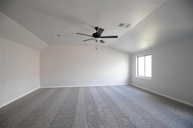 9312 Poppey Pl, Yukon, OK 73099 - empty room with lofted ceiling, ceiling fan, baseboards, and carpet