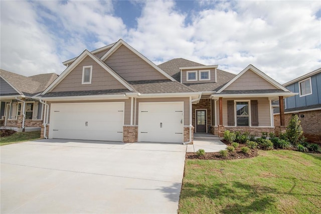 9312 Poppey Pl, Yukon, OK 73099 - craftsman house with an attached garage, driveway, a front yard, brick siding, and roof with shingles