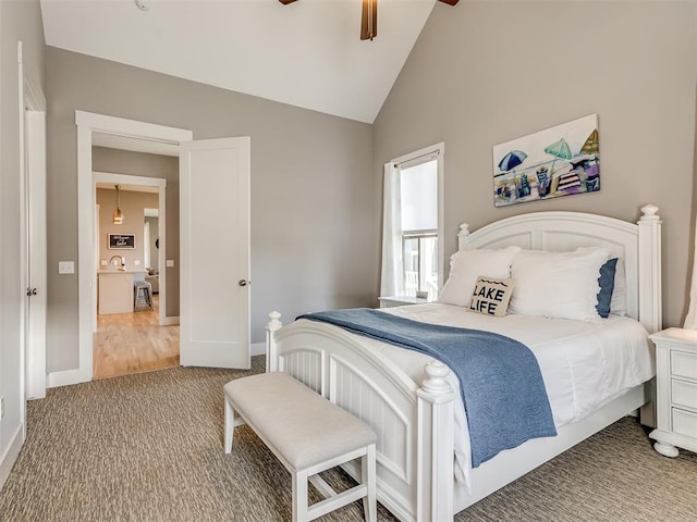 bedroom featuring carpet, ceiling fan, and lofted ceiling