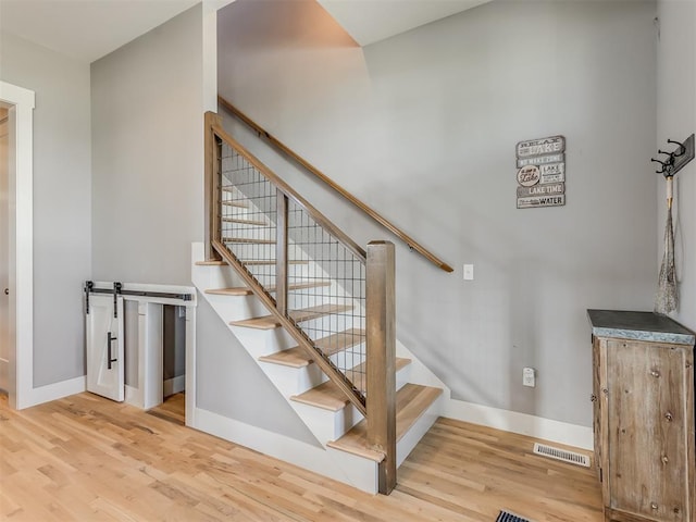 stairway featuring hardwood / wood-style floors