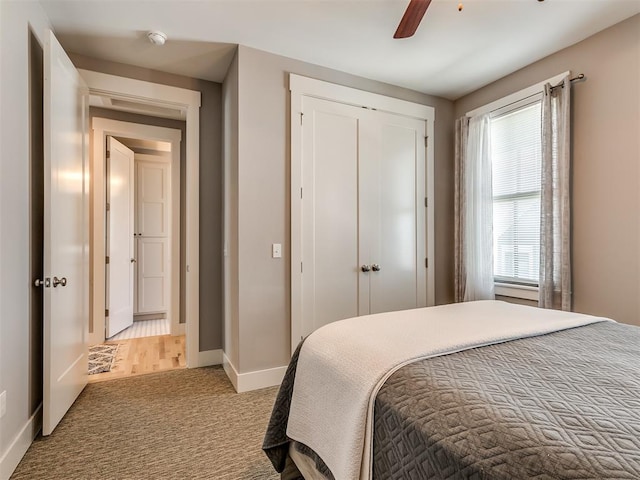 carpeted bedroom featuring ceiling fan