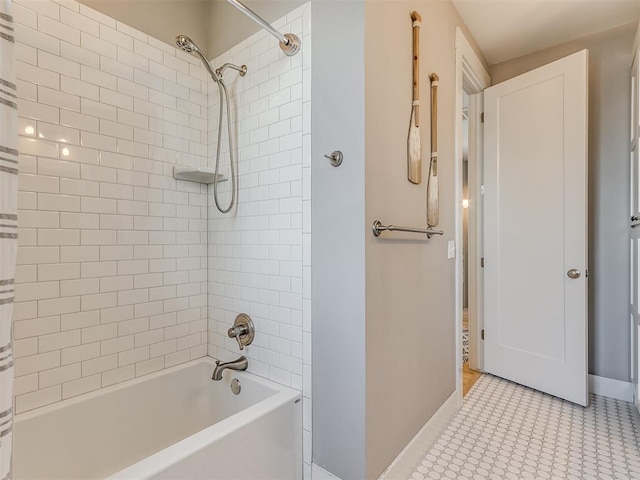 bathroom featuring tile patterned floors and tiled shower / bath combo