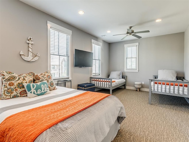 bedroom featuring light colored carpet and ceiling fan