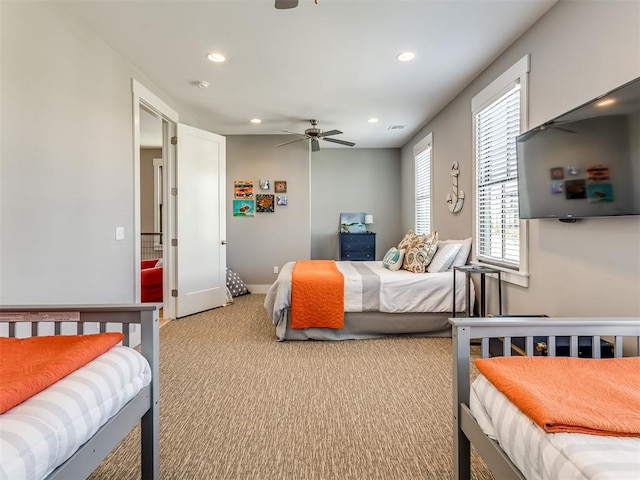 carpeted bedroom featuring ceiling fan