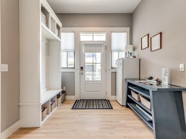 mudroom with light hardwood / wood-style flooring