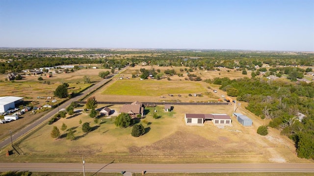 birds eye view of property with a rural view