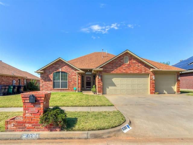 ranch-style home with a garage and a front lawn