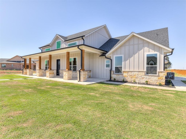 view of front of property featuring area for grilling and a front yard