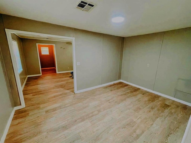 unfurnished room with light hardwood / wood-style floors