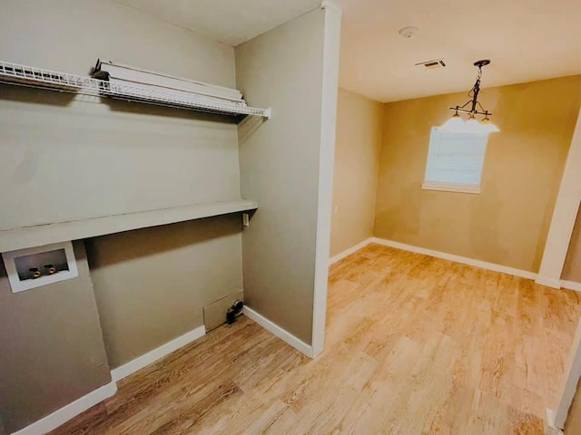 clothes washing area with washer hookup and hardwood / wood-style flooring