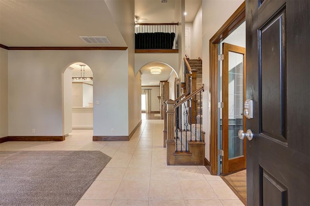 tiled entryway with crown molding