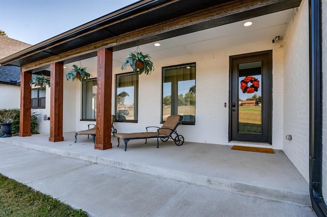 property entrance with covered porch