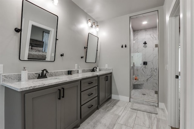 bathroom featuring vanity and a shower with door