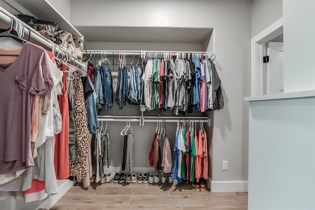 walk in closet featuring light wood-type flooring