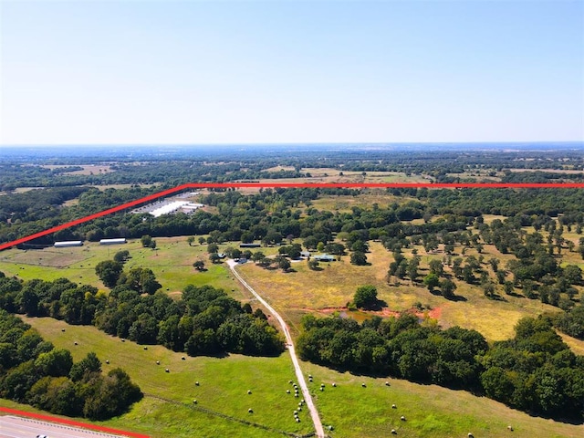 birds eye view of property with a rural view