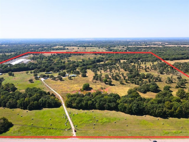 birds eye view of property with a rural view