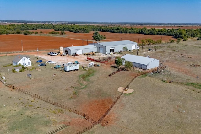 birds eye view of property featuring a rural view