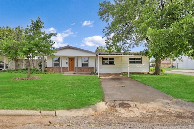 single story home featuring a front yard and a carport