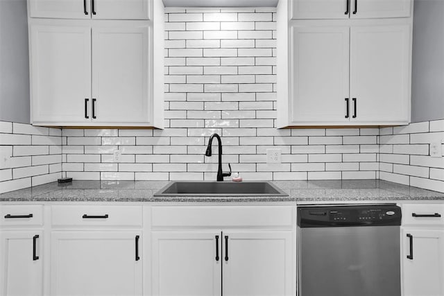 kitchen with dishwasher, decorative backsplash, white cabinets, and sink