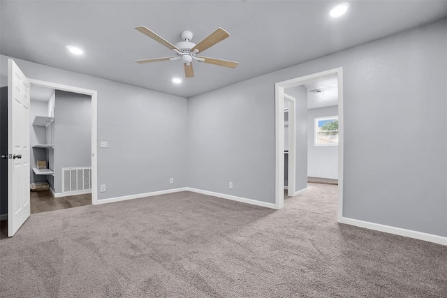 carpeted empty room with ceiling fan