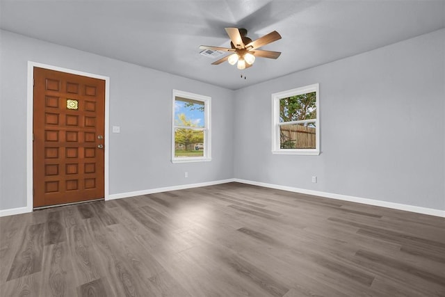 entrance foyer with baseboards, dark wood-style floors, and a ceiling fan