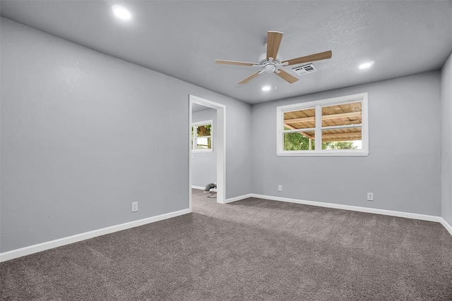 carpeted empty room featuring baseboards, visible vents, recessed lighting, and a ceiling fan