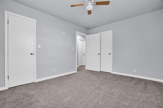 unfurnished bedroom with carpet floors, baseboards, and ceiling fan