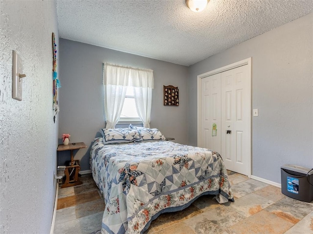 bedroom featuring a closet and a textured ceiling