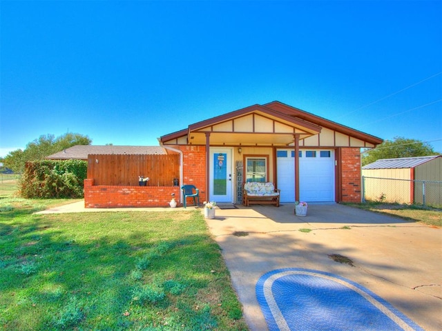 view of front of house with a porch, a garage, and a front lawn