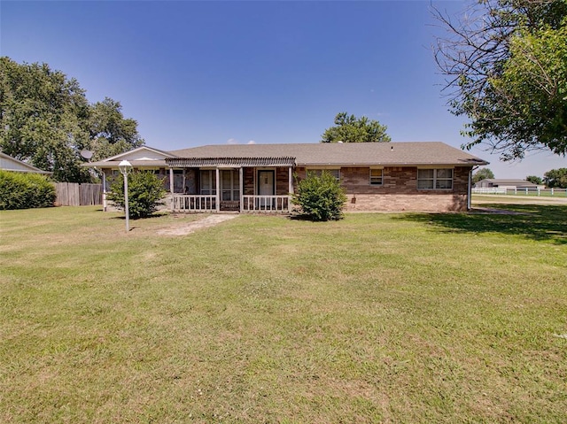 rear view of house with a yard