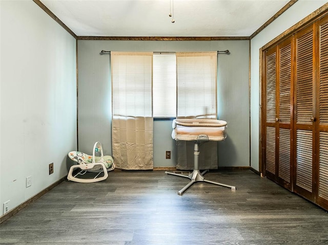 unfurnished bedroom featuring dark hardwood / wood-style flooring, a closet, and crown molding