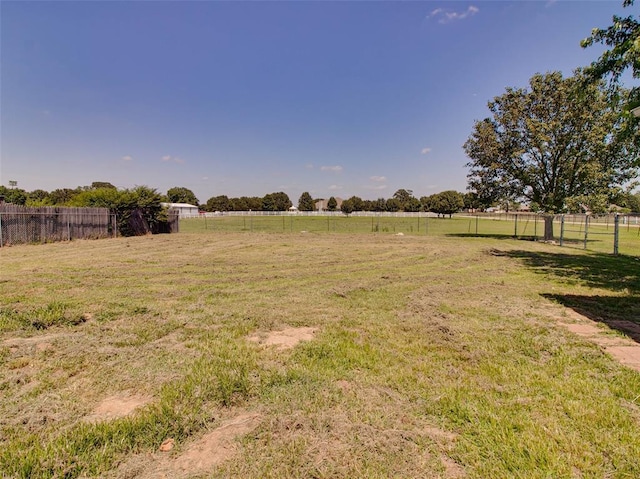 view of yard with a rural view