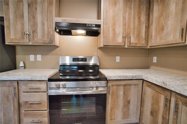 kitchen featuring stainless steel range oven