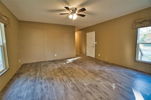 spare room featuring hardwood / wood-style floors and ceiling fan