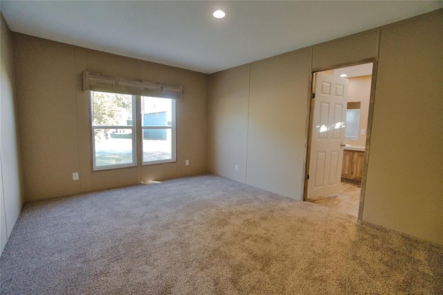 empty room featuring light carpet