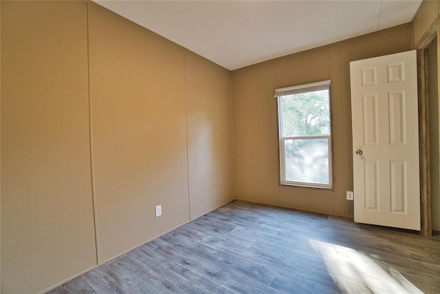 unfurnished room featuring wood-type flooring