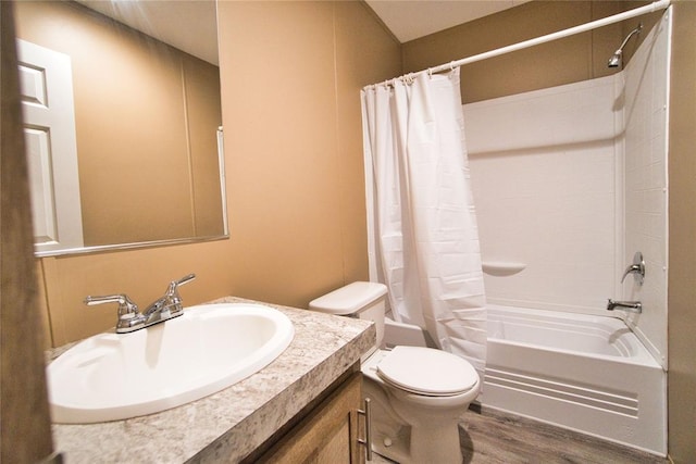 full bathroom with toilet, vanity, hardwood / wood-style flooring, and shower / tub combo with curtain