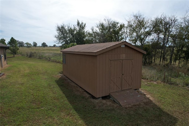 view of outdoor structure with a lawn