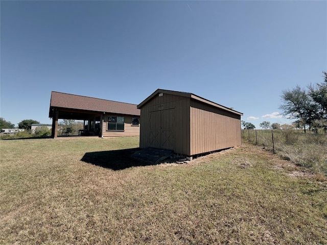 view of outdoor structure featuring a yard