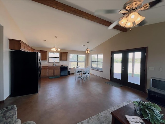 interior space featuring lofted ceiling with beams, ceiling fan with notable chandelier, sink, and french doors