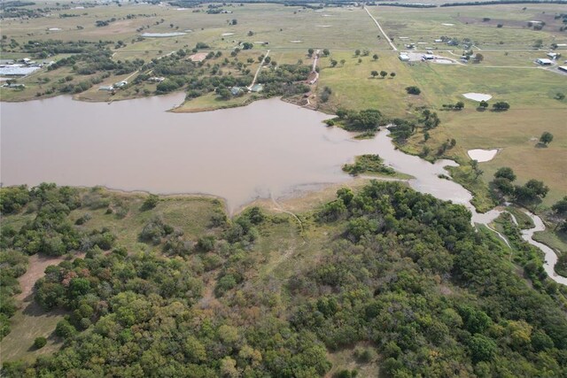 birds eye view of property featuring a rural view and a water view