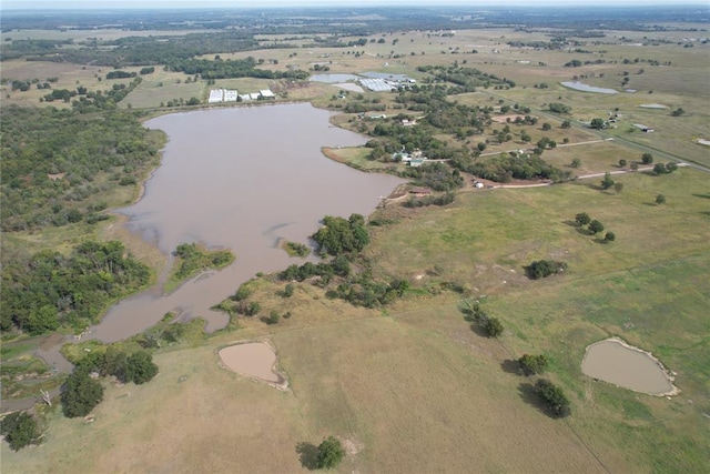 drone / aerial view featuring a water view and a rural view